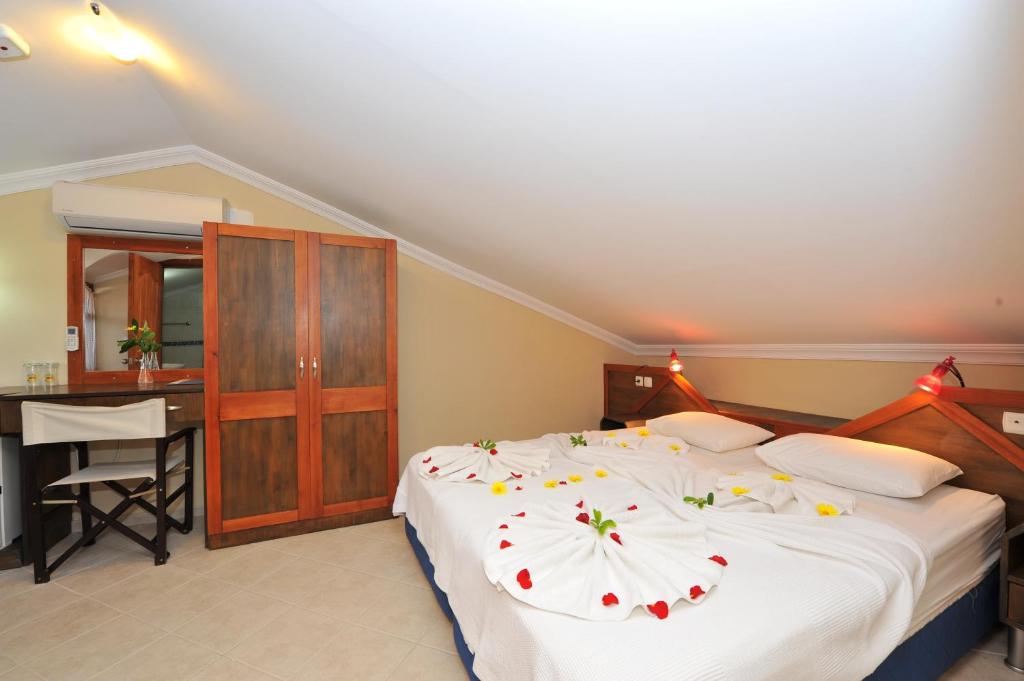 Postel nebo postele na pokoji v ubytování Grenadine Lodge
