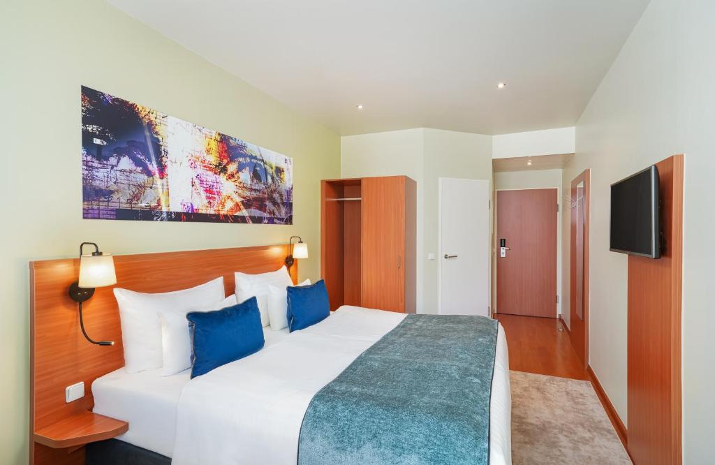 Posteľ alebo postele v izbe v ubytovaní Leonardo Hotel Salzburg Airport