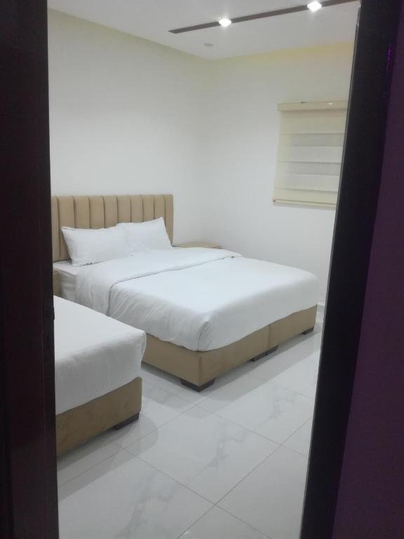 Postel nebo postele na pokoji v ubytování Mussa Spring Hotel