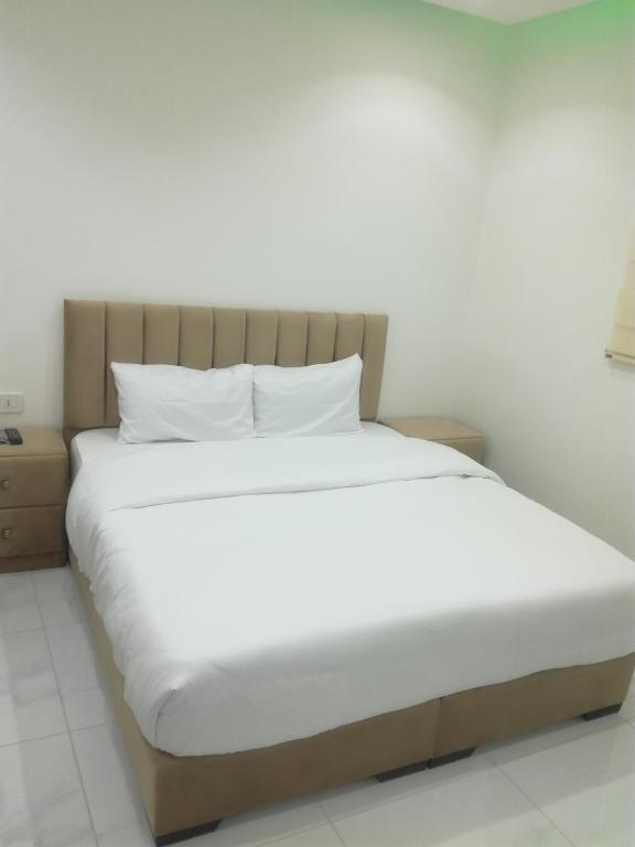 Postel nebo postele na pokoji v ubytování Mussa Spring Hotel