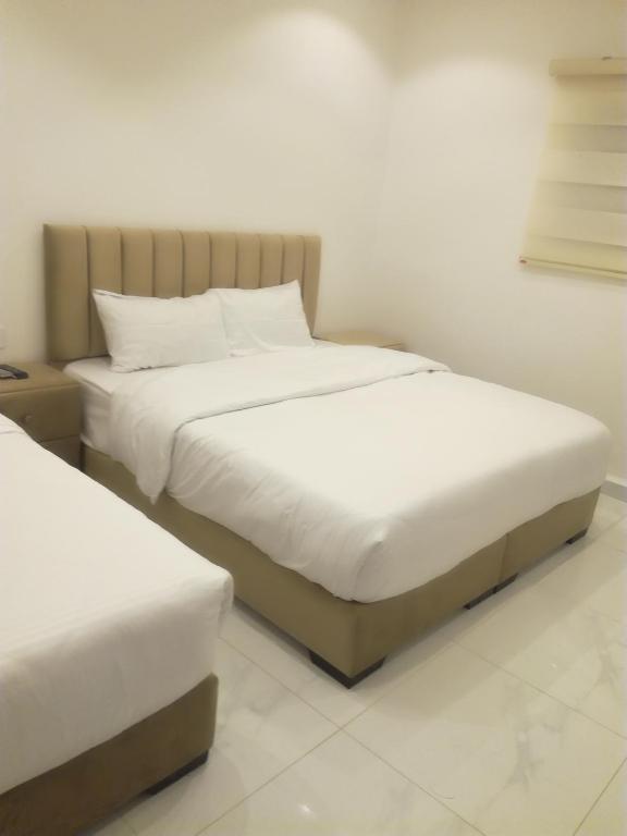 Postel nebo postele na pokoji v ubytování Mussa Spring Hotel