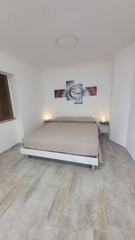 Postel nebo postele na pokoji v ubytování Luciae Domus