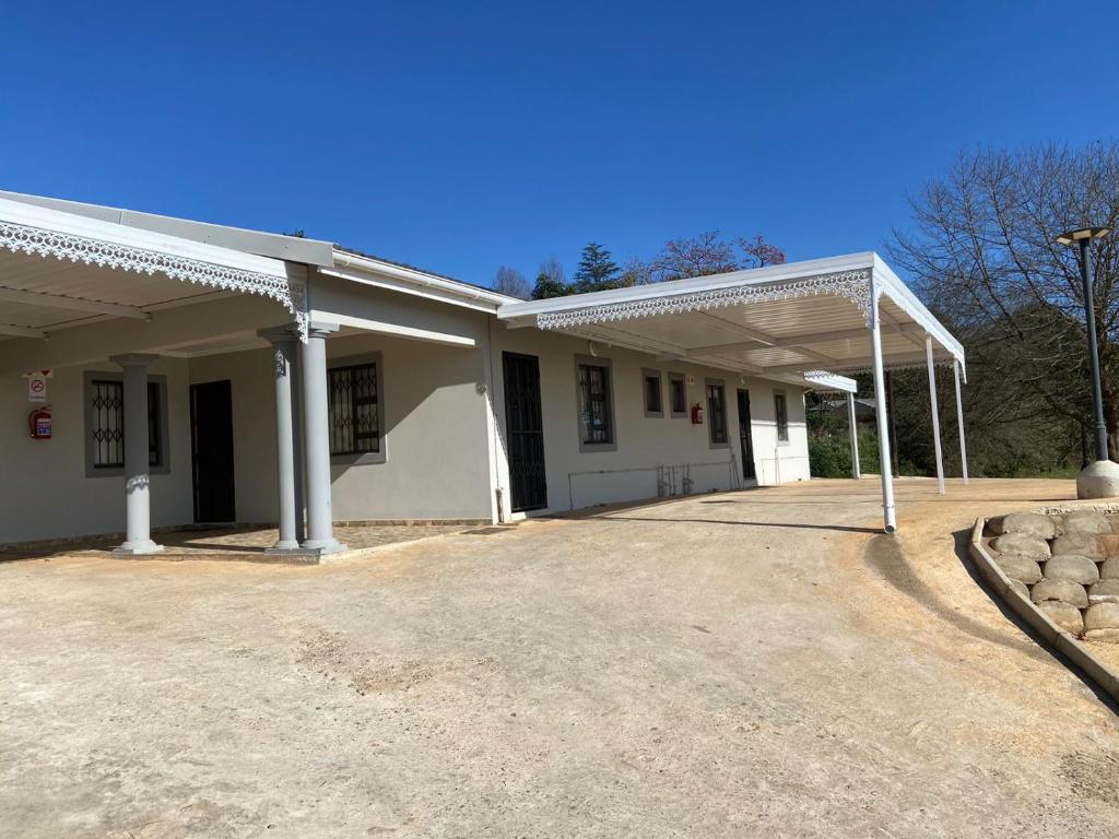 a large white building with a lot at Valleyview home Ixopo in Ixopo