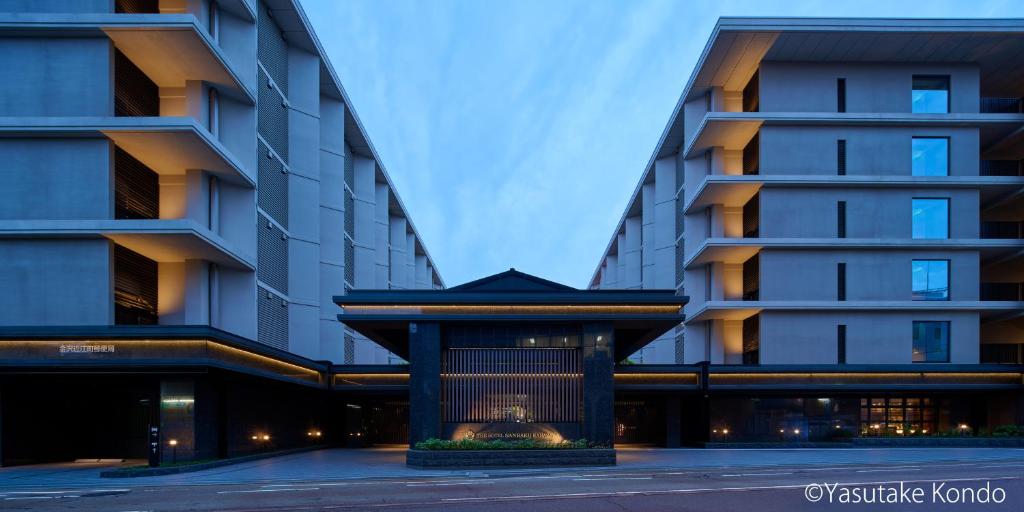 two tall buildings with a bird cage in front of them at THE HOTEL SANRAKU KANAZAWA 21th December 2022 OPEN in Kanazawa