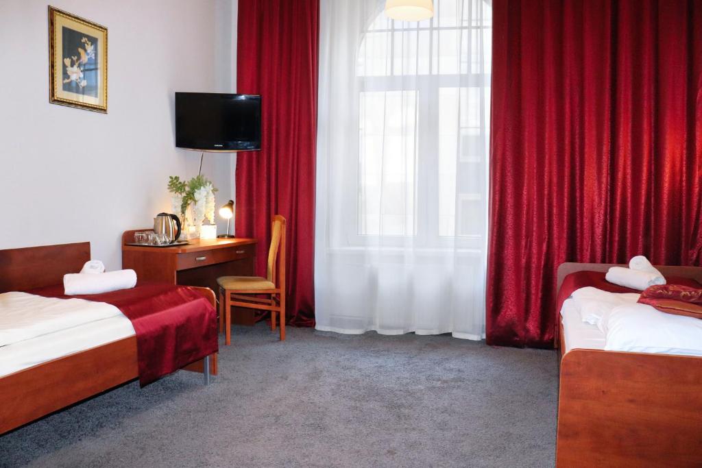 Posteľ alebo postele v izbe v ubytovaní Hotel Lothus