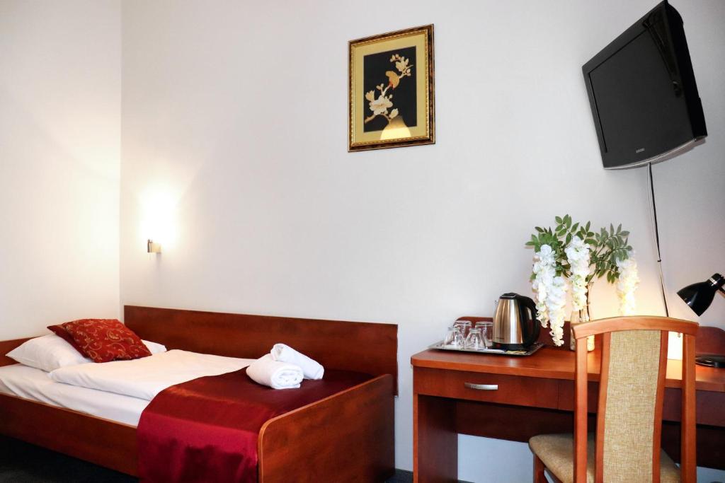 Televízia a/alebo spoločenská miestnosť v ubytovaní Hotel Lothus