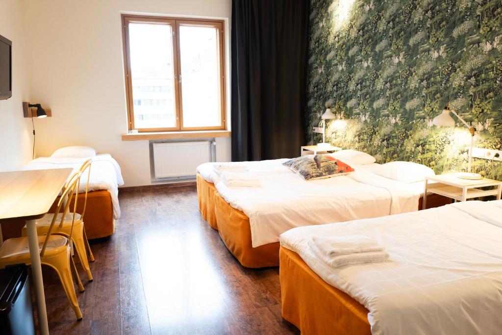 Postel nebo postele na pokoji v ubytování Hotel Finn
