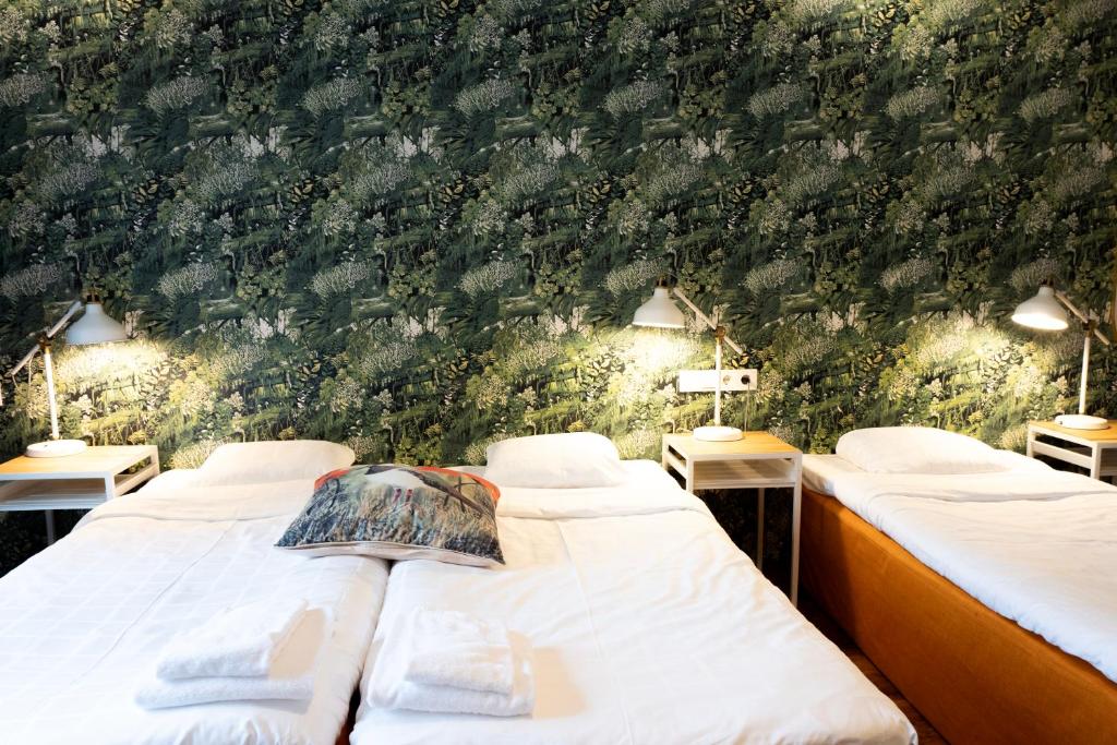 Postel nebo postele na pokoji v ubytování Hotel Finn