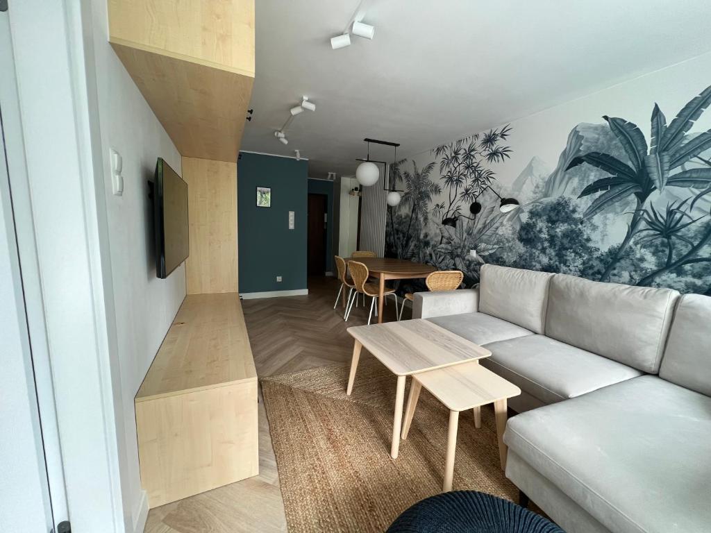 Televízia a/alebo spoločenská miestnosť v ubytovaní LTC Apartments Wzgórze św Maksymiliana