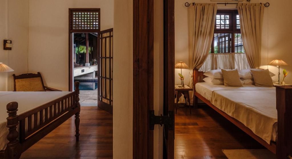 Postel nebo postele na pokoji v ubytování Havelock Place Bungalow