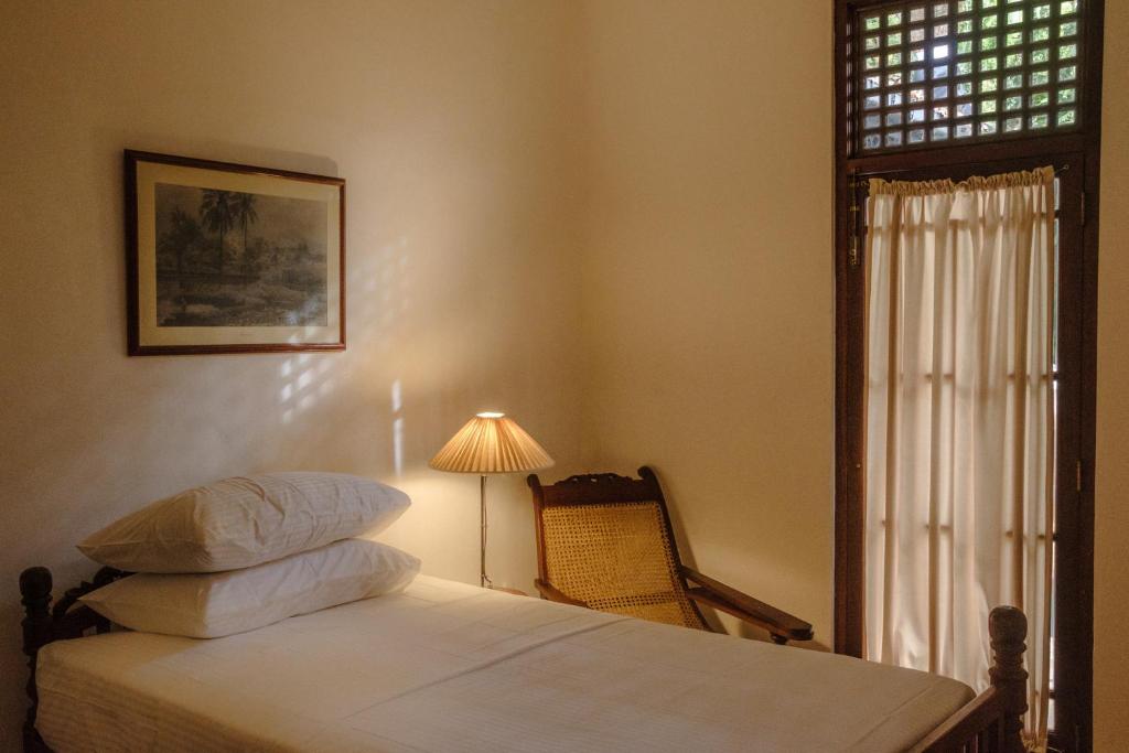 Postel nebo postele na pokoji v ubytování Havelock Place Bungalow
