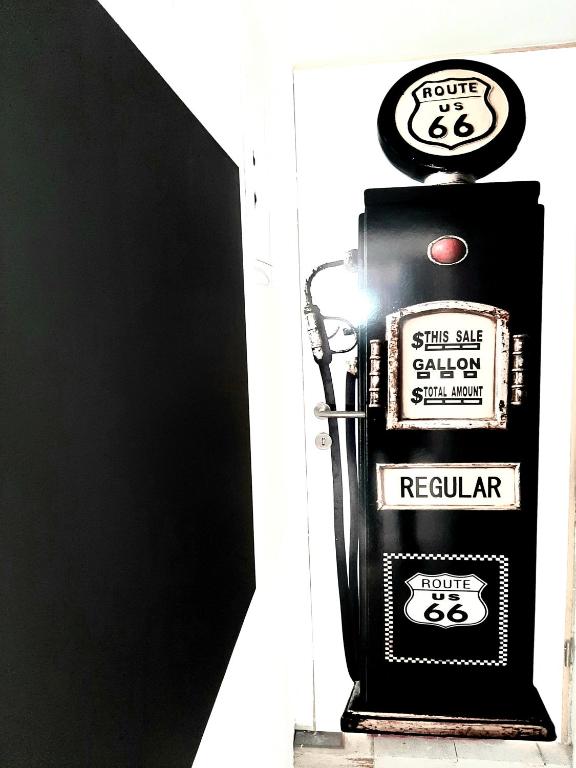 a sign for a petrol pump on the side of a building at Apartments House of Art in Nin