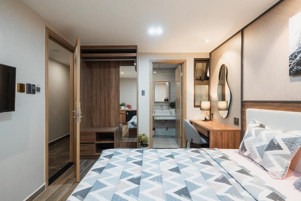 Giường trong phòng chung tại Thảo Nguyên House