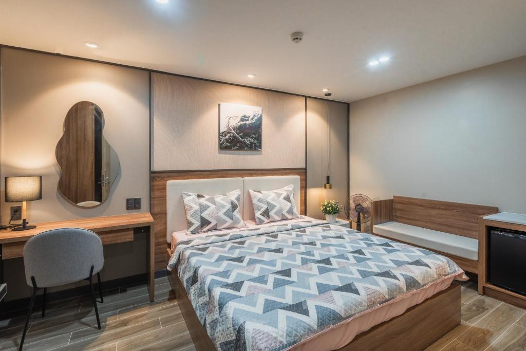 Giường trong phòng chung tại Thảo Nguyên House