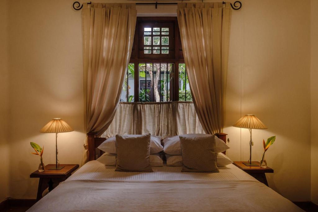 Postel nebo postele na pokoji v ubytování Havelock Place Bungalow