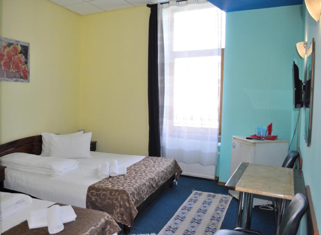 Postel nebo postele na pokoji v ubytování Pension Flamingo