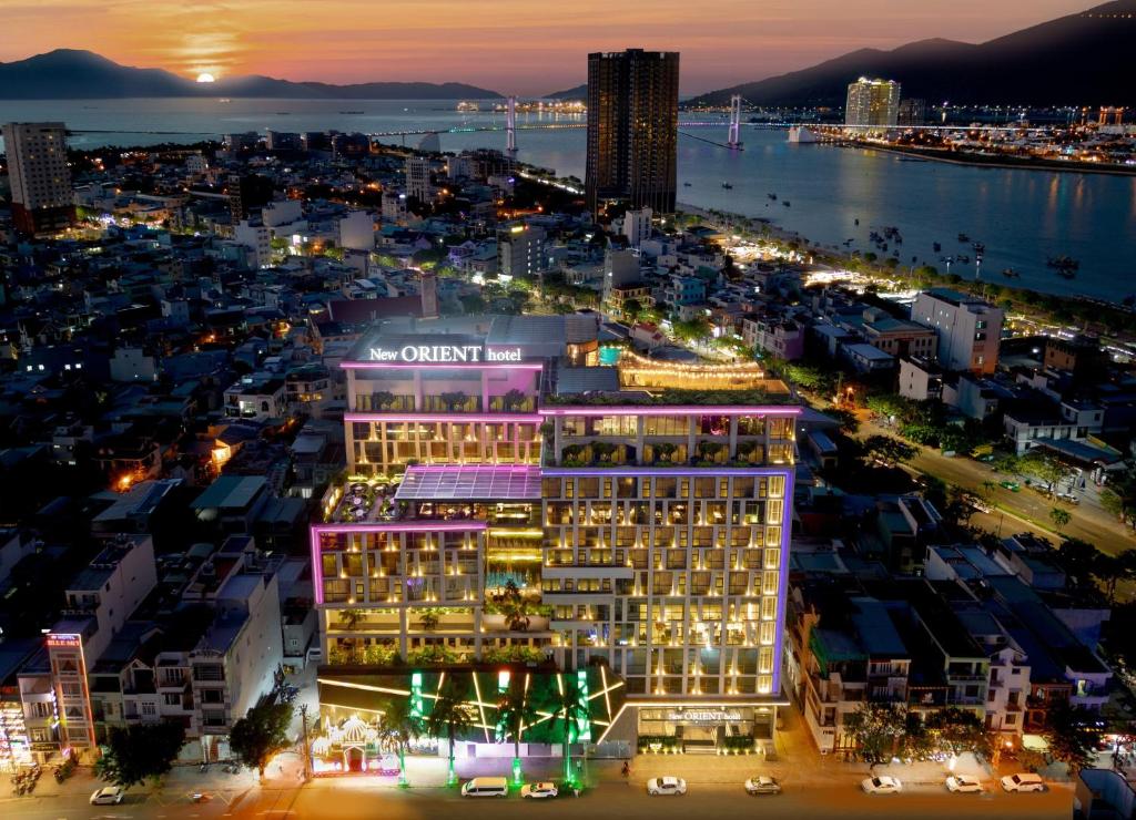 an aerial view of a city at night at New Orient Hotel Da Nang in Danang
