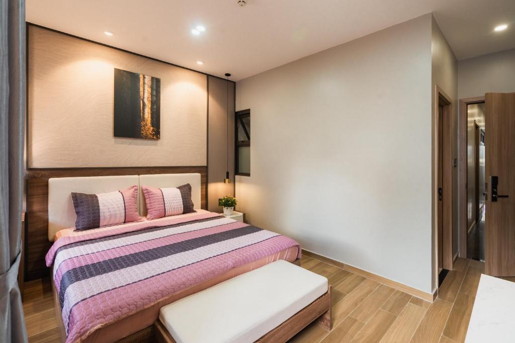 Giường trong phòng chung tại Thảo Nguyên House