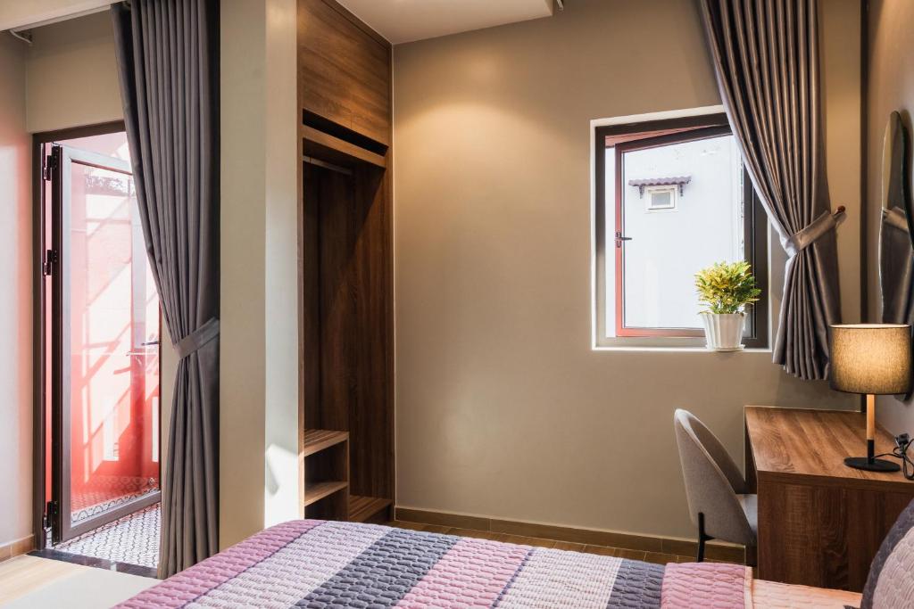 Giường trong phòng chung tại Thảo Nguyên House