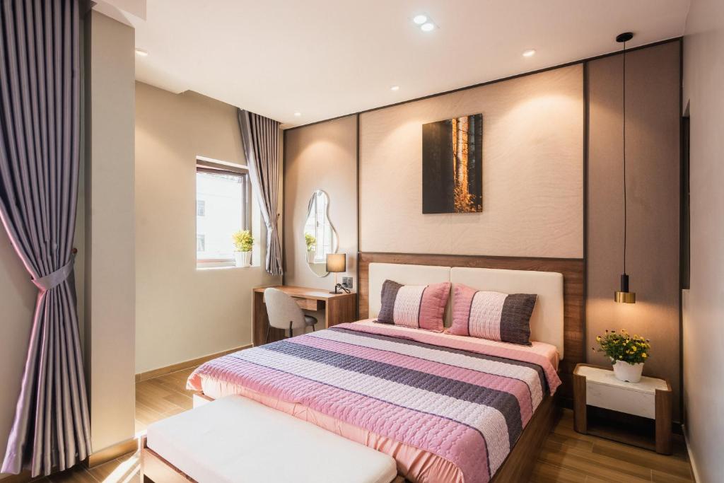 Giường trong phòng chung tại Thảo Nguyên House
