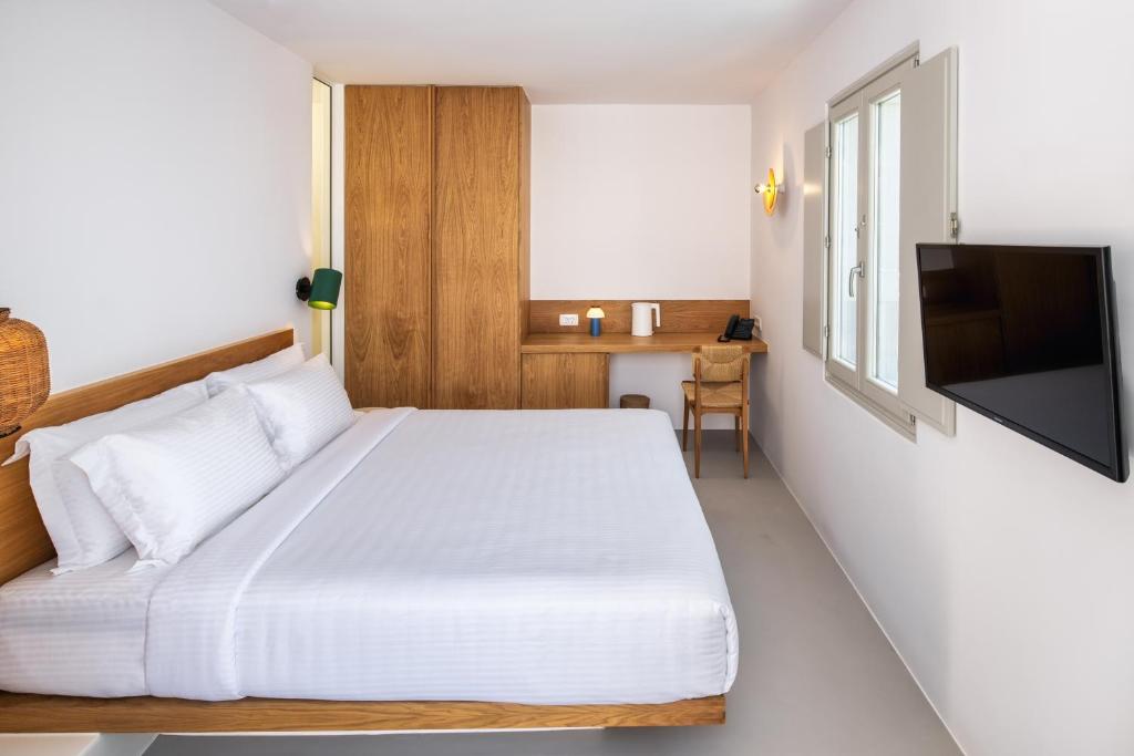 Postel nebo postele na pokoji v ubytování Viva Nove Suites