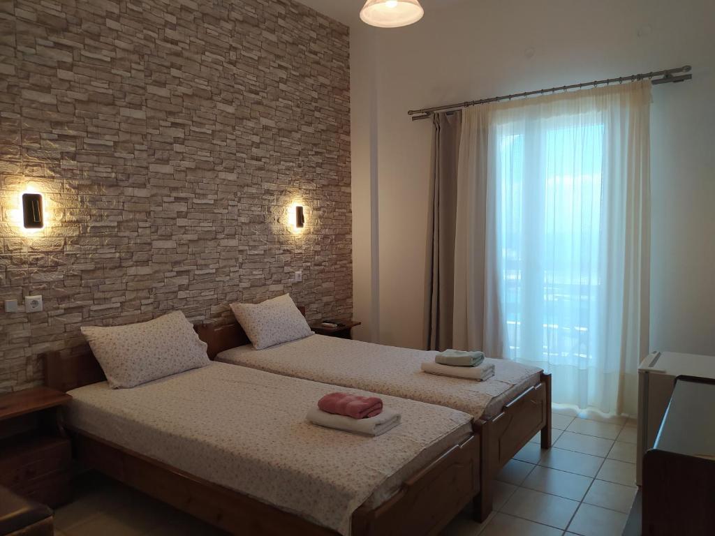 Postel nebo postele na pokoji v ubytování Corali Hotel