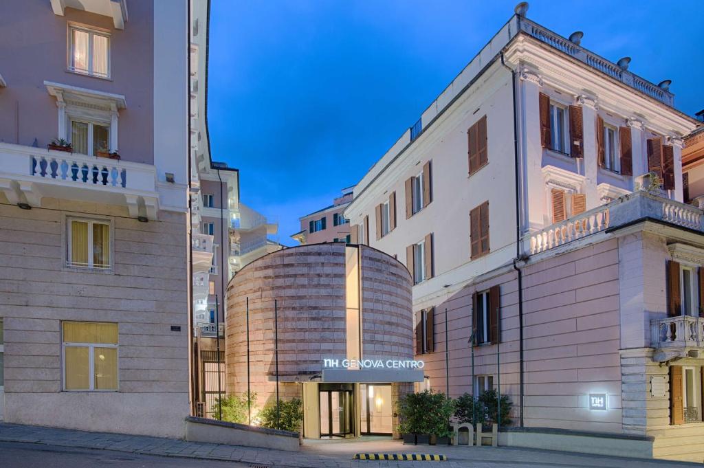 a building with a silo in front of it at NH Genova Centro in Genoa