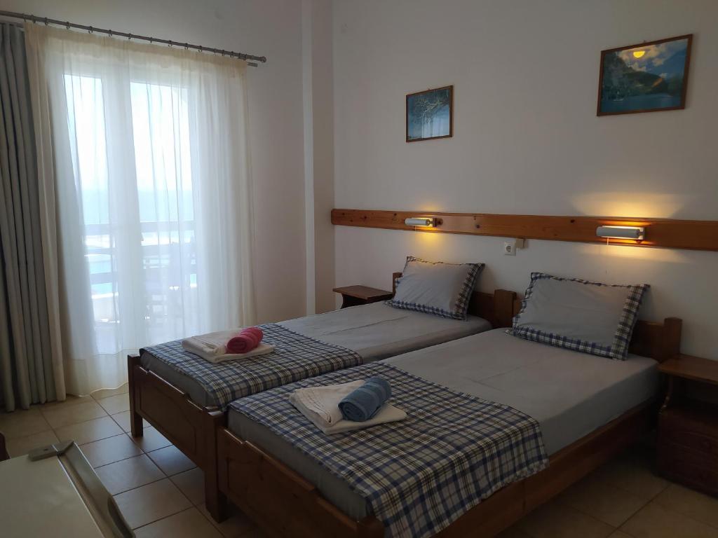 Postel nebo postele na pokoji v ubytování Corali Hotel