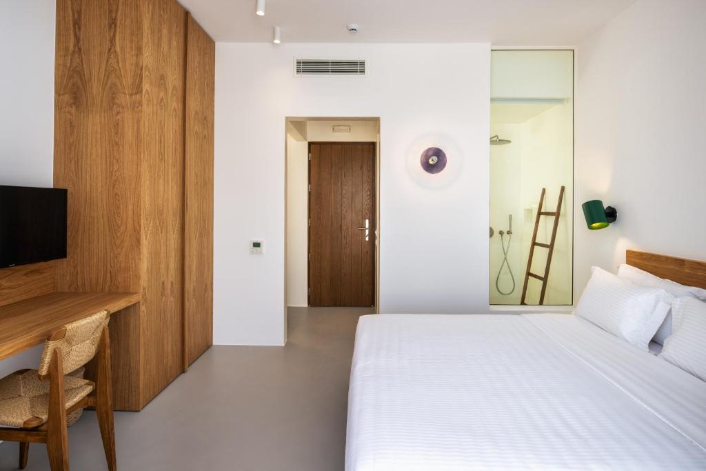 Postel nebo postele na pokoji v ubytování Viva Nove Suites