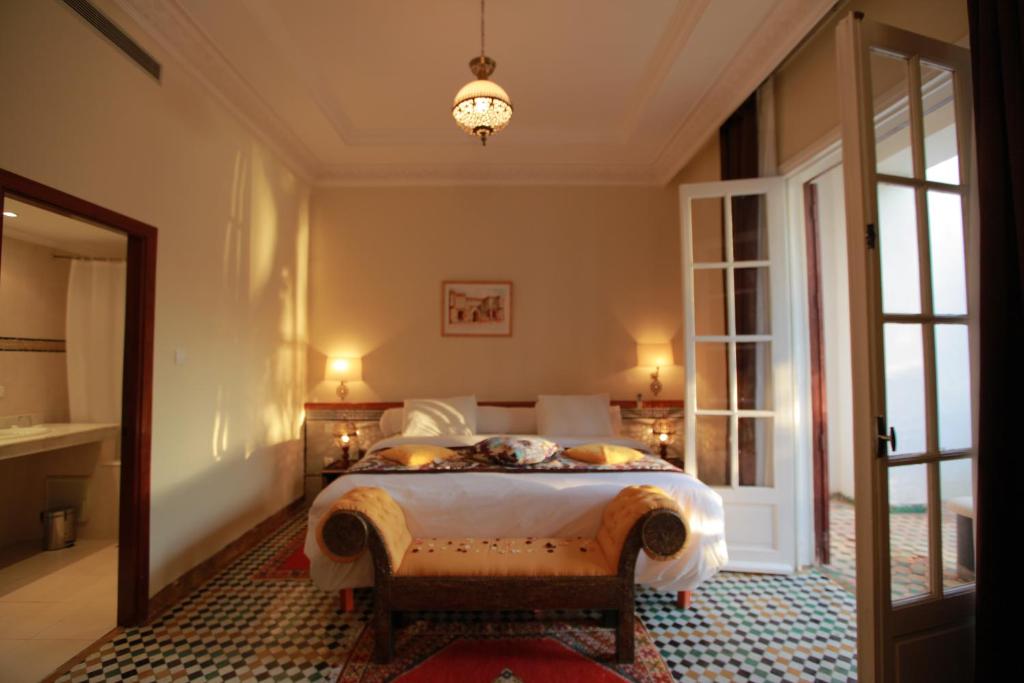 Postel nebo postele na pokoji v ubytování Hotel Transatlantique