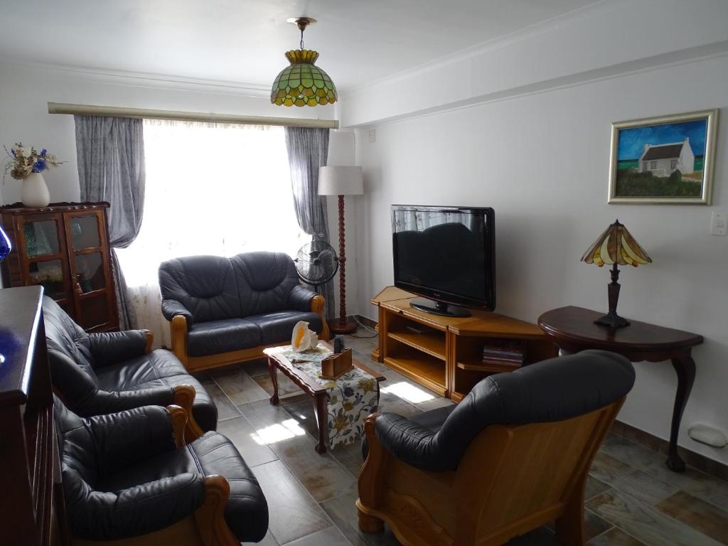TV o dispositivi per l'intrattenimento presso Big Skies Guesthouse