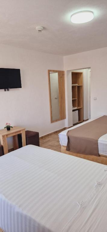 Postel nebo postele na pokoji v ubytování Hotel Ancora