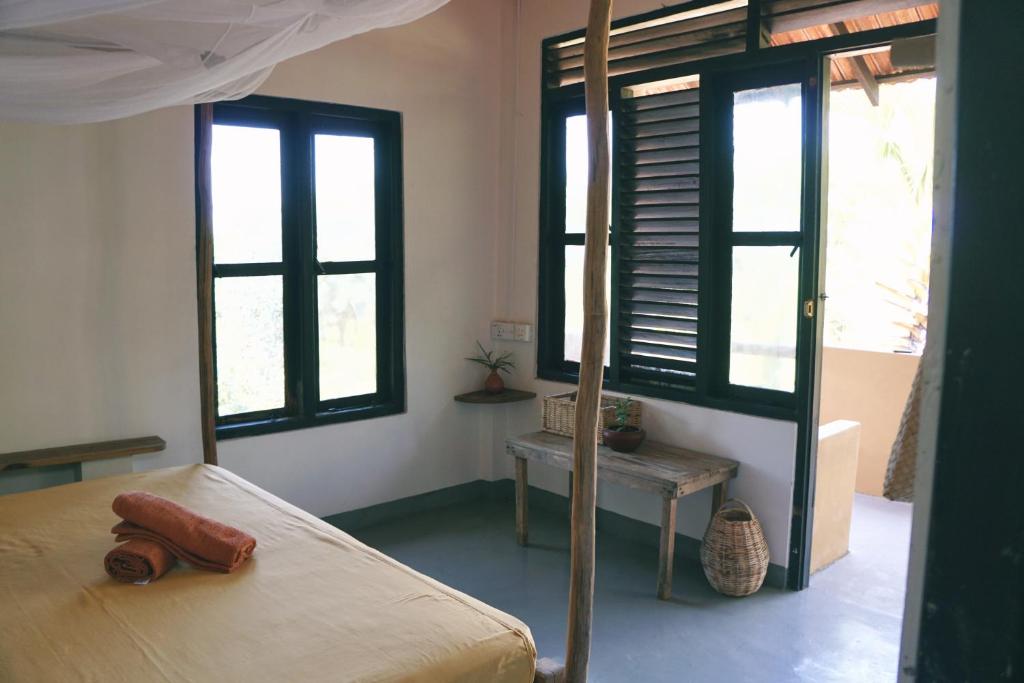 Postel nebo postele na pokoji v ubytování Hilltop Cabanas