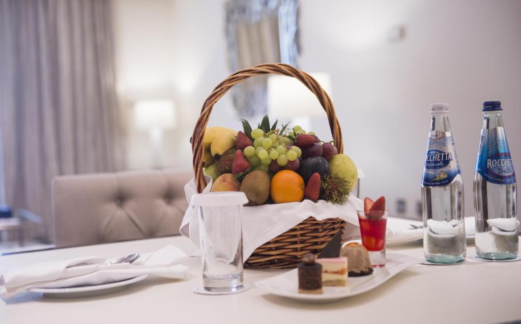 a basket of fruit sitting on top of a table at Mirfa Hotel in Al Mirfa