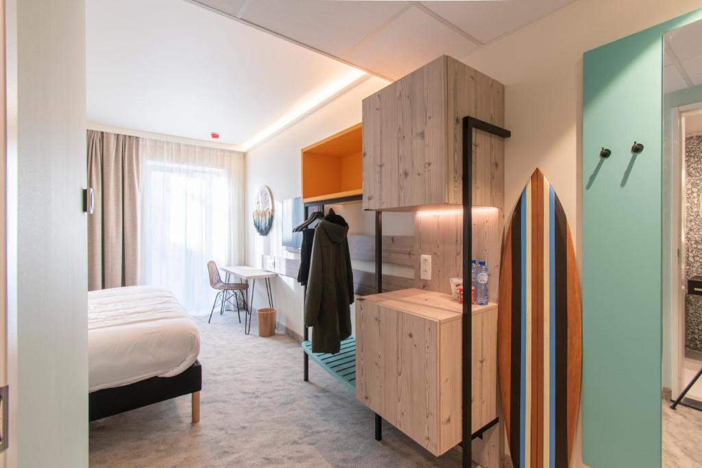 Postel nebo postele na pokoji v ubytování ibis Styles Bredene