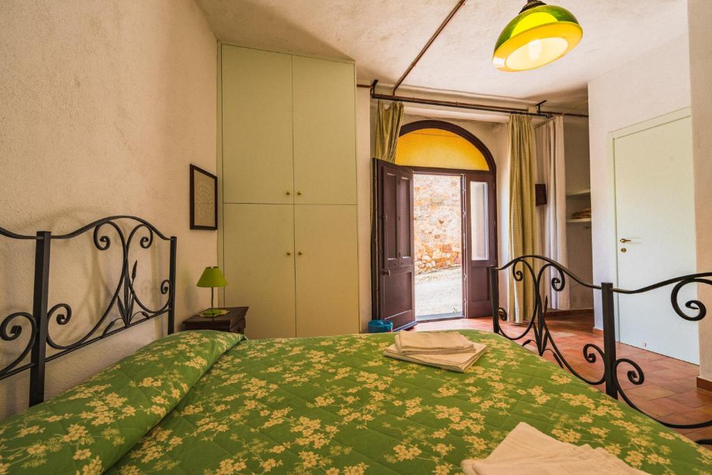 Postel nebo postele na pokoji v ubytování Borgo De Salaioli