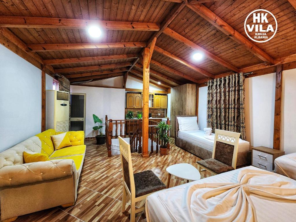 a living room with a couch and a bed in it at Vila HK in Krujë