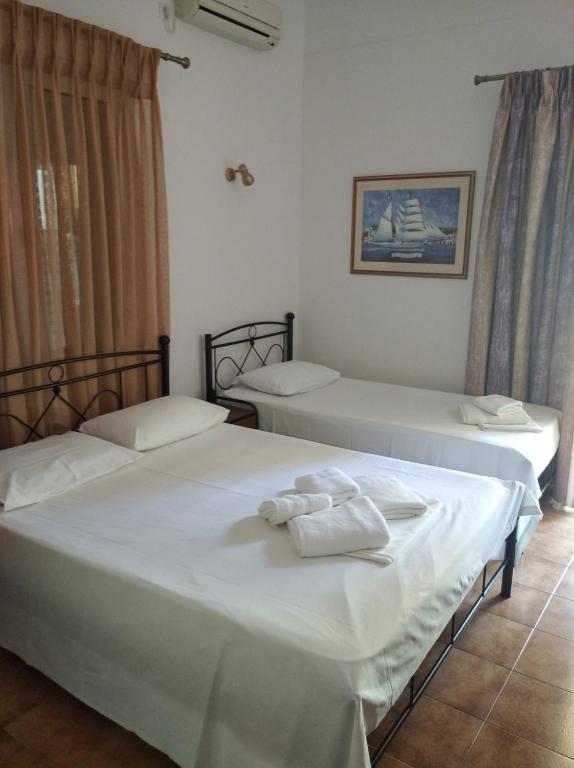 Postel nebo postele na pokoji v ubytování Hotel Ion