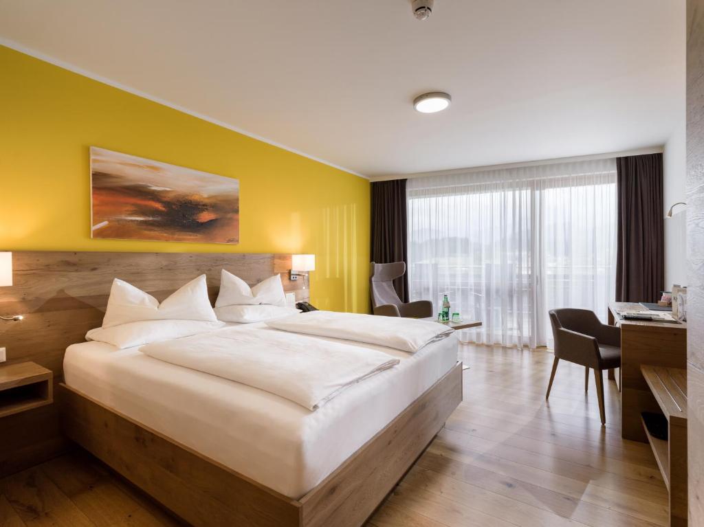 Letto o letti in una camera di DAS SIEBEN - Adults Only
