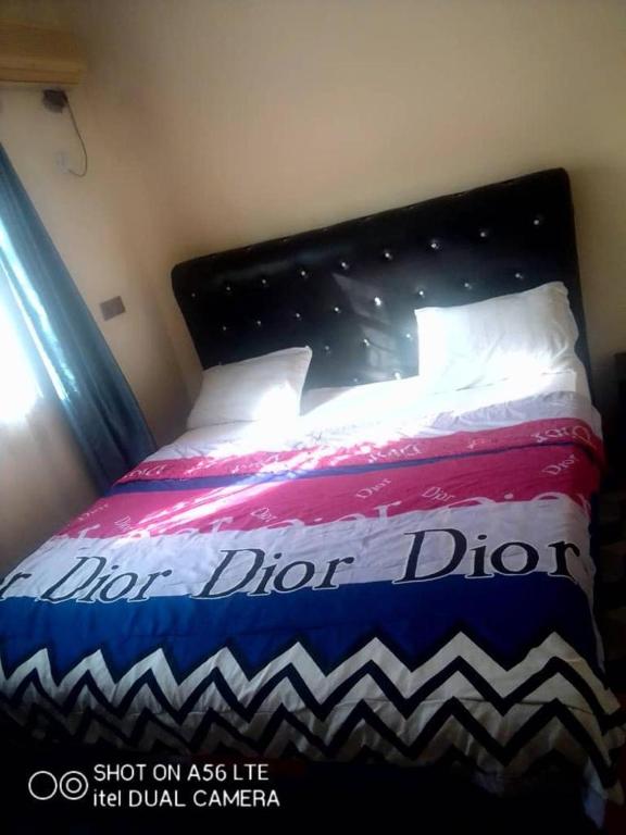 Postel nebo postele na pokoji v ubytování Funkytee Hotel & Apartment