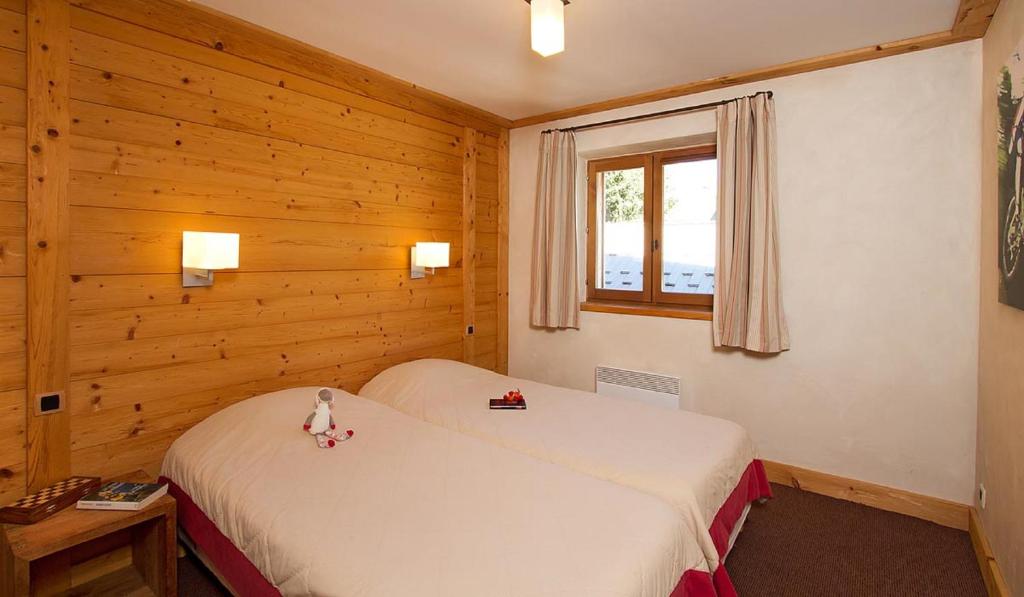 Postel nebo postele na pokoji v ubytování Vacancéole - Résidence Cortina