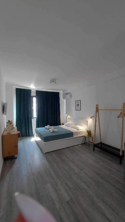 Postel nebo postele na pokoji v ubytování Unique Experience Apartment’s