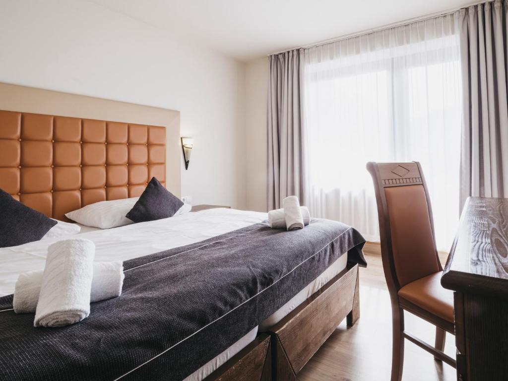 Postel nebo postele na pokoji v ubytování Hotel Victoria by VAYA