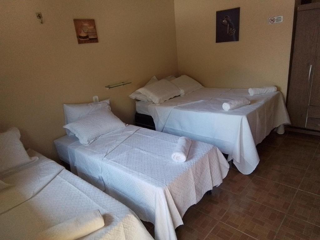 Postel nebo postele na pokoji v ubytování Pousada Sossego Ronaldo e Clarinha