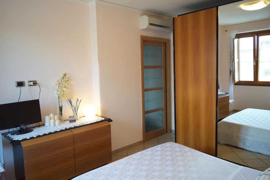 A bed or beds in a room at Casa Tonia