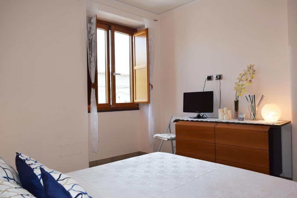 A bed or beds in a room at Casa Tonia