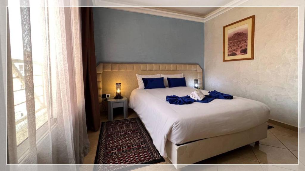 Un ou plusieurs lits dans un hébergement de l'établissement Hotel Al Massira