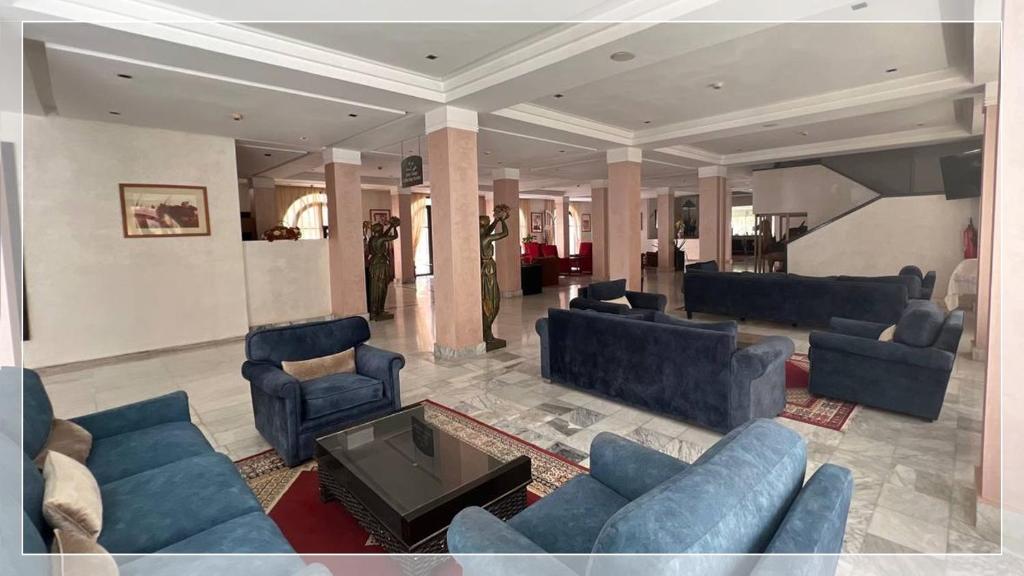 Coin salon dans l'établissement Hotel Al Massira