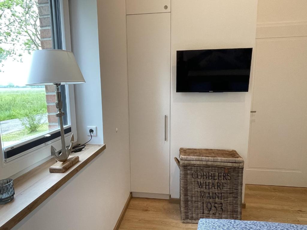 TV a/nebo společenská místnost v ubytování Ferienhaus Hallix