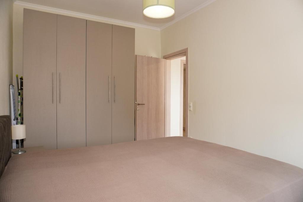 Postel nebo postele na pokoji v ubytování Filios Apartment